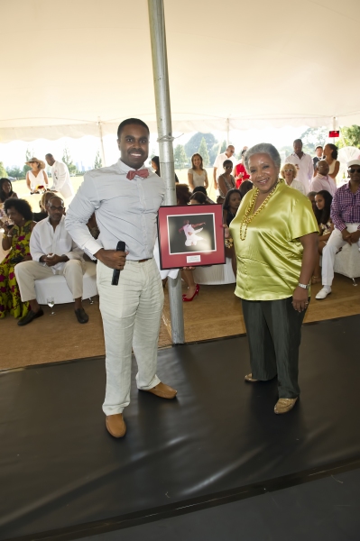 Dr. Ancy Verdier presents Lola C. West with her award Photo