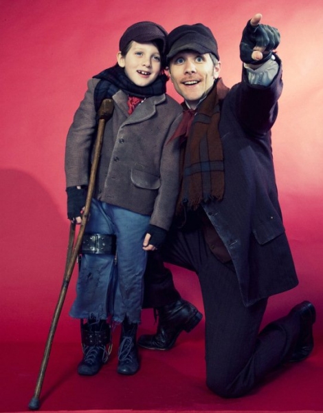 Price Clark as Tiny Tim and Adam Hose as Bob Cratchit Photo