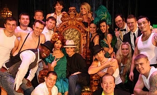 Taye Diggs and Idina Menzel posing with the cast of ABSINTHE Photo
