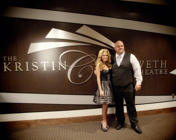 BAPAC Executive Director and Kristin in front of her new wall decoration 
in the lobby naming the theatre for her at 