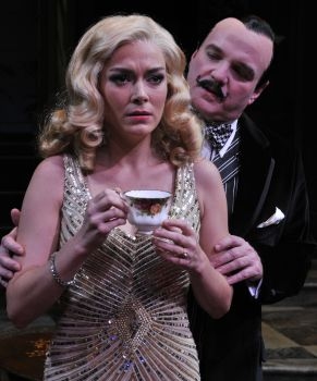 (Left to Right) Laura E. Campbell as Lucia Amory and James Black as Hercule Poirot in Photo